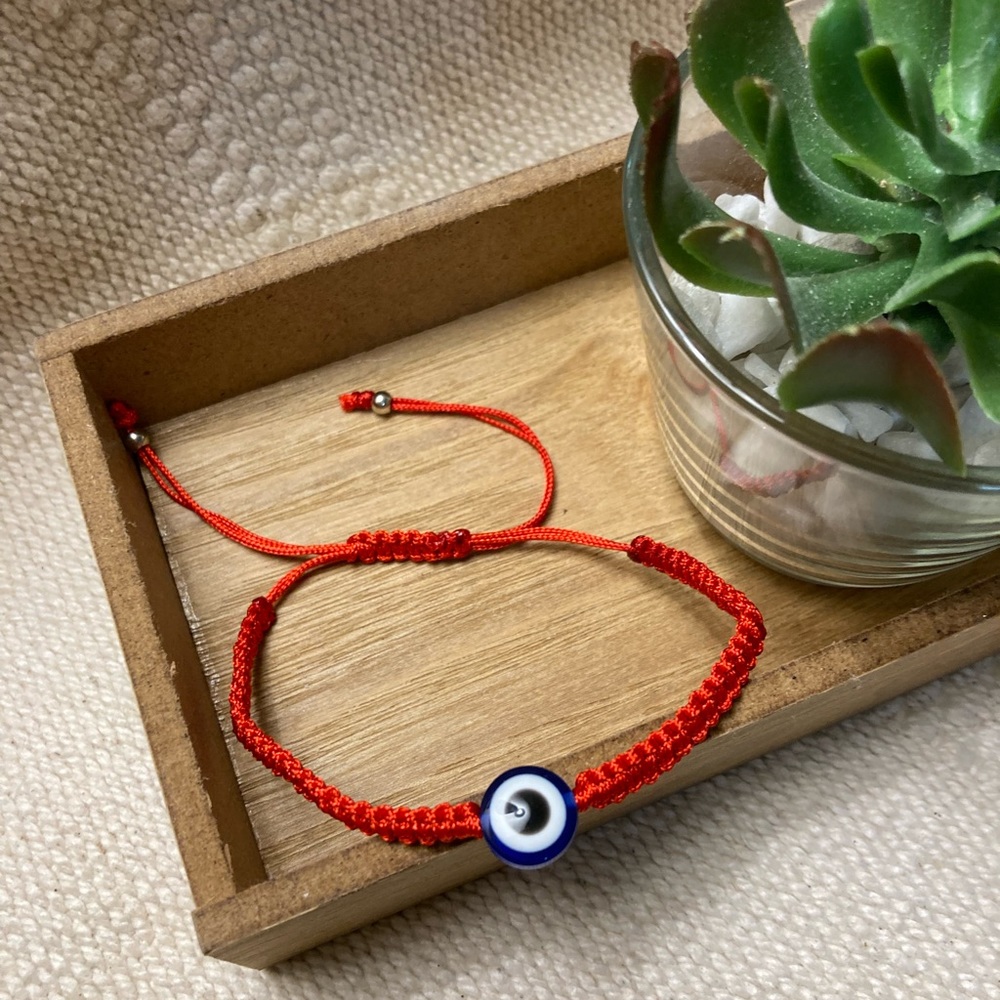 Set of three red braided bracelets